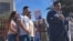 The family of Guadalupe Garcia de Rayos stands behind her attorney, Ray Ybarra Maldonado, as he speaks in front of the U.S. Immigration and Customs Enforcement office in Phoenix, Feb. 9, 2017.