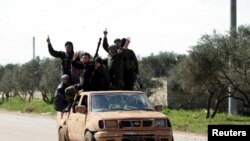 A father&#39;s day card sits among flowers left for the victims of the Grenfell apartment tower fire in North Kensington, London.