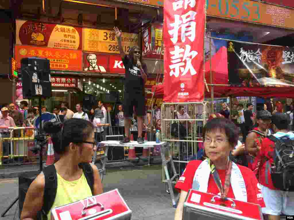 Haas F1&#39;s Danish driver Kevin Magnussen removes his helmet after the Abu Dhabi Formula One Grand Prix at the Yas Marina circuit in Abu Dhabi, United Arab Emirates.