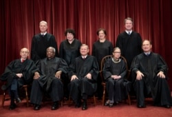 The justices of the U.S. Supreme Court: Seated from left- Stephen Breyer, Clarence Thomas, Chief Justice John G. Roberts, Ruth Bader Ginsburg and Samuel Alito Jr.; Standing from left- Neil Gorsuch, Sonia Sotomayor, Elena Kagan and BretT Kavanaugh