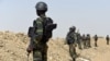 FILE - A picture taken on February 17, 2015 shows Cameroonian soldiers patrolling in the Cameroonian town of Fotokol, on the border with Nigeria, after clashes occurred between Cameroonian troops and Nigeria-based Boko Haram insurgents.