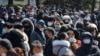 People line up to buy face masks to protect themselves from the new coronavirus outside Nonghyup Hanaro Mart in Seoul, South Korea, Thursday, March 5, 2020. The number of infections of the COVID-19 disease spread around the globe. (AP Photo/Ahn…