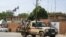 A patrol of the Niger national Police drives past the French Embassy in Niamey on August 28, 2023.