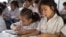 FILE - Primary students are reading during a classroom session at Kesararam primary school, in Siem Reap province, on Friday, March 20, 2015. (Nov Povleakhena/VOA Khmer)