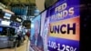 A television screen on the floor of the New York Stock Exchange shows the rate decision of the Federal Reserve, July 26, 2017. The Federal Reserve is keeping its benchmark interest rate unchanged at a time of low inflation, which remains persistently below the Fed's target level.