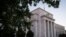 FILE - The Federal Reserve headquarters in Washington.