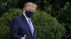 FILE - President Donald Trump leaves the White House for Walter Reed National Military Medical Center on the South Lawn of the White House in Washington, Oct. 2, 2020. 