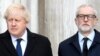 FILE - Caption Britain's Prime Minister Boris Johnson and opposition Labour Party leader Jeremy Corbyn attend a vigil for victims of a fatal attack on London Bridge, Dec. 2, 2019.