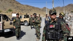 Afghan special forces stand guard at the site of a suicide car bomb explosion that killed at least four people, on the outskirts of Kabul, Afghanistan, Sept. 12, 2019.