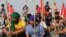 Farmers block railway tracks as part of protests against farm laws during nationwide protests, in Sonipat, northern state of Haryana, India, Sept. 27, 2021. 