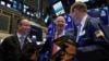Traders work on the floor of the New York Stock Exchange in New York, Oct. 16, 2018. 