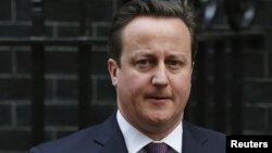 Britain's Prime Minister David Cameron leaves Number 10 Downing Street to attend Prime Minister's Questions at parliament in London January 16, 2013.