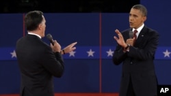 Republican presidential nominee Mitt Romney and President Barack Obama spar over energy policy during the second presidential debate at Hofstra University, October 16, 2012.