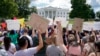 FILE - Supporters of the Deferred Action for Childhood Arrivals program demonstrate on Pennsylvania Avenue in front of the White House in Washington, Sept. 9, 2017. 