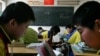 FILE - Children study in small rural primary school in the Chang ling Xia Cou village, north of Beijing, China.
