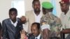 Somalia's newly elected President Hassan Sheikh Mohamud gestures, surrounded by his security guards, during a news conference at Jazeera Palace hotel in Mogadishu September 12, 2012. 