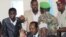 Somalia's newly elected President Hassan Sheikh Mohamud gestures, surrounded by his security guards, during a news conference at Jazeera Palace hotel in Mogadishu September 12, 2012. 