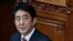 Japan's Prime Minister Shinzo Abe delivers his policy speech at the lower house of parliament in Tokyo February 28, 2013. Abe, whose country is embroiled in a row with China over tiny islands, on Thursday quoted former British Prime Minister Margaret That