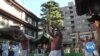 In Japan, Worshippers Take Frosty Plunge Against COVID-19 
