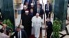 Pope Francis walks alongside Muslim clerics during a visit at the prestigious Sunni institution al-Azhar in Cairo on April 28, 2017, during an official visit to Egypt.