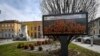 A municipality panel reads in Italian " Corona Virus, as a precaution the population is invited to stay home ", in Casalpusterlengo, Northern Italy,Feb. 23, 2020.