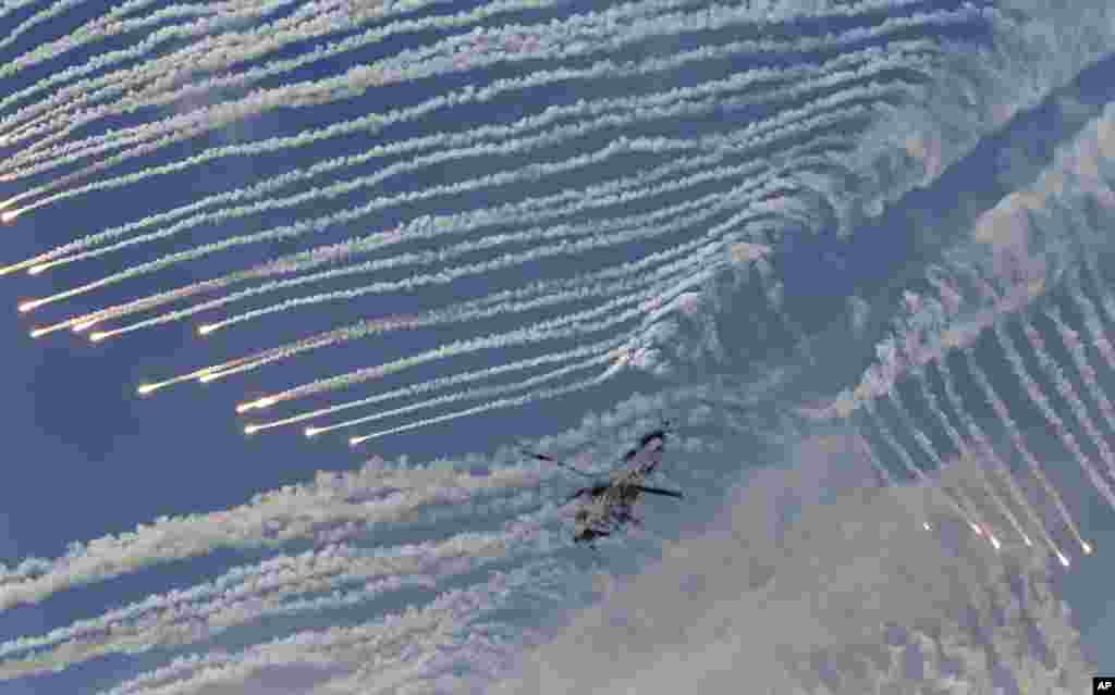 South Korean army&#39;s Surion helicopter fires flare shells during the South Korea-U.S. joint military live-fire drills at Seungjin Fire Training Field in Pocheon, near the border with North Korea.