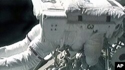 Mission Specialist Randy Bresnik works outside of the International Space Station during the final spacewalk of the STS-129 mission, 23 Nov 2009