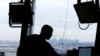 FILE - In this May 21, 2015 file photo, an air traffic controller works in a tower at Newark Liberty International Airport. African air traffic safety and security experts are calling for more investment to guarantee safe air travel on the continent.