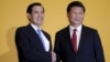 Chinese President Xi Jinping shakes hands with Taiwan's President Ma Ying-jeou during a summit in Singapore November 7, 2015.