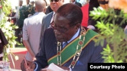 President Robert Mugabe swearing in ministers