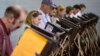 FILE - Voters use electronic voting machines at the Schiller Recreation Center polling station on election day, Nov. 3, 2015, in Columbus, Ohio.