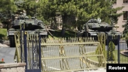 Tanks stand in front of the Turkish General Staff headquarters in Ankara, Turkey, July 17, 2016.