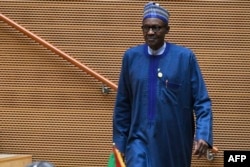 Nigeria's president, Muhammadu Buhari, walks after speaking at the opening of the Ordinary Session of the Assembly of Heads of State and Government during the 30th annual African Union summit in Addis Ababa, Jan. 28, 2018.