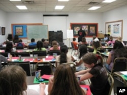 This is an obviously well-attended workshop, specifically on how to create graphic novels, at a library in Franklin Park, Illinois.