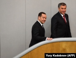 RUSSIA -- Russian Prime Minister Dmitry Medvedev (L) and Volodin (R) walk upstairs prior Medvedev's speech in the State Duma in Moscow on April 11, 2018.