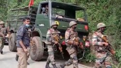 This image from video shows Indian army soldiers arriving at the site after an army helicopter carrying India's Chief of Defense Staff Bipin Rawat crashed near Coonoor, Tamil Nadu state, India, Dec. 8, 2021.