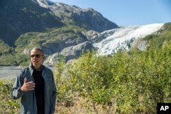 President Barack Obama speaks to members of the media while on a hike to the Exit Glacier in Seward, Alaska, Sept. 1, 2015.
