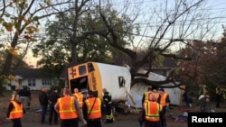 Rescue officials at the scene of a school bus crash involving several fatalities in Chattanooga, Tennessee, Nov. 21, 2016. 