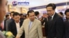 Prime Minister Hun Sen, center, and Commerce Minister Pan Sorasak, right, are pictured together at a trade expo, Phnom Penh, Cambodia, December 15, 2017. (Photo courtesy of Ministry of Commerce)