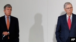 Sen. Roy Blunt, R-Mo., left, and Senate Majority Leader Mitch McConnell of Kentucky maintain social distancing as they attend a press conference on Capitol Hill in Washington, May 19, 2020.