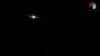 This image grab taken from a handout video released by the Syrian General Organization of Radio and Television late on Aug. 24, 2019 shows lights in the sky reportedly over Aqraba, southeast of the Syrian capital Damascus during an Israeli airstrike.