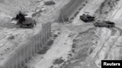 تصاویر منتشر شده توسط ارتش اسرائیل حرکت خودروهای نظامی به شمال غزه را نشان می‌دهد. ۲۶ اکتبر ۲۰۲۳