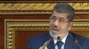 Image from Egyptian State Television shows Egyptian President Mohammed Morsi speaking at the Shura Council, the country's upper house of parliament, Cairo, December 29, 2012.