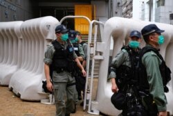 Riot police are seen during a march against new security laws, near China's Liaison Office, in Hong Kong, China, May 22, 2020.