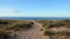 National parks traveler Mikah Meyer soaks in the picturesque seashore of Cape Cod, Massachusetts during an unseasonably balmy day in October.