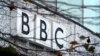 FILE - A BBC logo is seen at the company's main offices, in west London. Three journalists for British Broadcasting Corporation were attacked in Malawi under suspicion of being vampires.