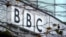 FILE - A BBC logo is seen at the company's main offices, in west London. Three journalists for British Broadcasting Corporation were attacked in Malawi under suspicion of being vampires.