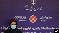 The supervisor of the Coviran Barekat Covid-19 vaccine research team, Dr. Monoo Mohraz, sits prior to receiving the vaccine during the third phase of the clinical trial of the Iranian developed vaccine, during a staged event at the Eram Grand Hotel…