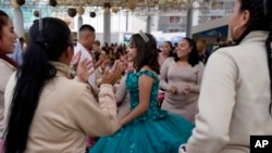 FILE - Daughters of imprisoned women celebrate their 15th birthday, a tradition called quinceanera, at the San Marta Acatitla rehabilitation in the Iztapalapa neighborhood of Mexico City, Friday, Aug. 18, 2023. (AP Photo/Arnulfo Franco)