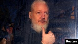 WikiLeaks founder Julian Assange arrives at the Westminster Magistrates Court, after he was arrested in London, Britain, April 11, 2019. 
